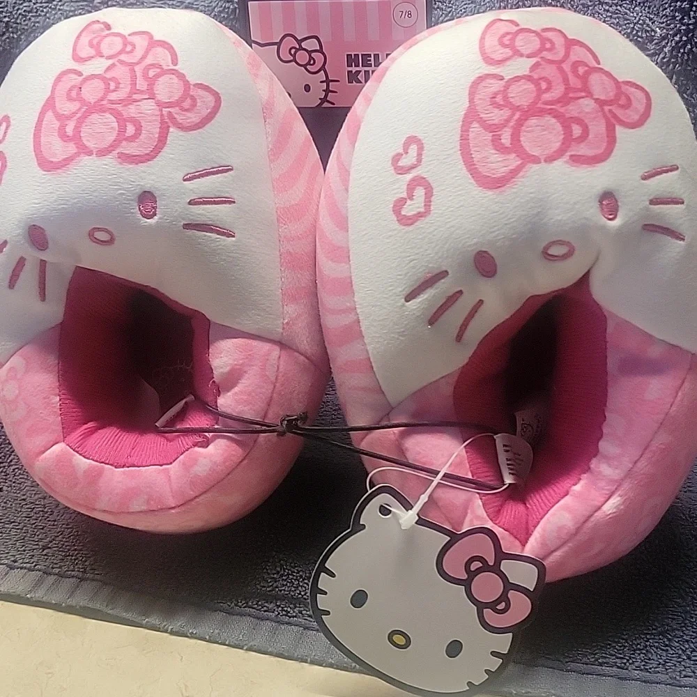 Hello Kitty Pink Plush Slippers and Headband Set. Skippers are size 7/8.